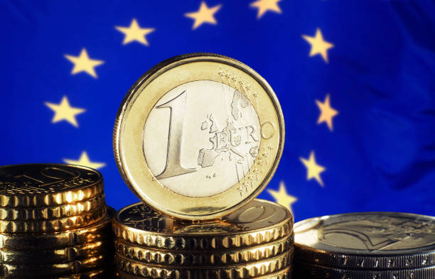 istock Euro coin and European flag 670930204
