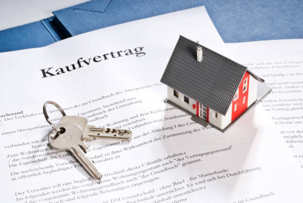 House with key and purchase contract House with key and purchase contract gebäude stock pictures, royalty-free photos & images