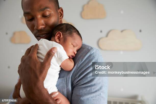 Father Holding Newborn Baby Son In Nursery Stock Photo - Download Image Now - Baby - Human Age, Father, Newborn