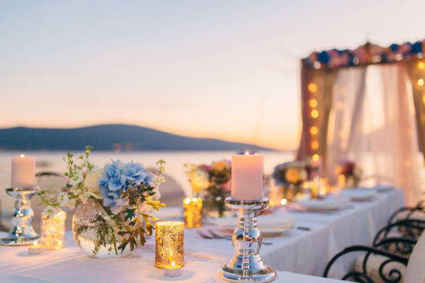 istock Candles on the wedding table at a banquet 670934290
