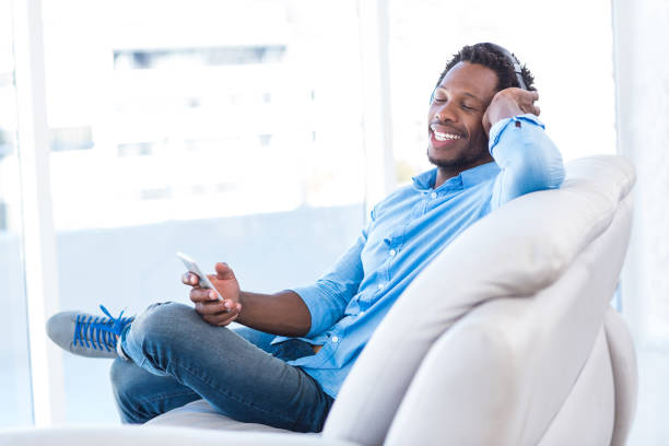 istock Relaxed man enjoying music 670938802