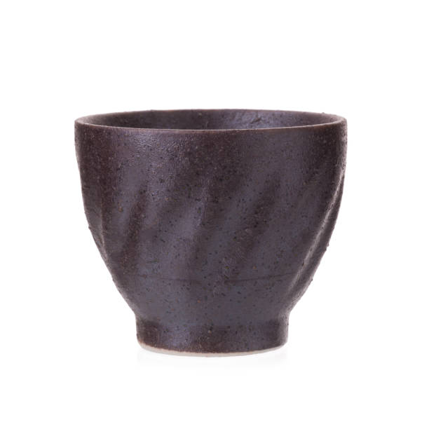 istock Black traditional tea cup of cast iron isolated on white background 670941372