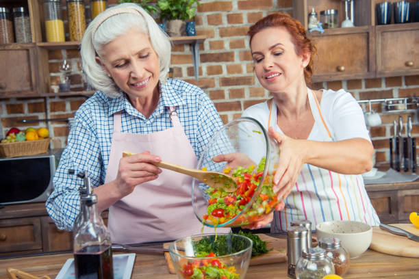 istock Women cooking together 670941404