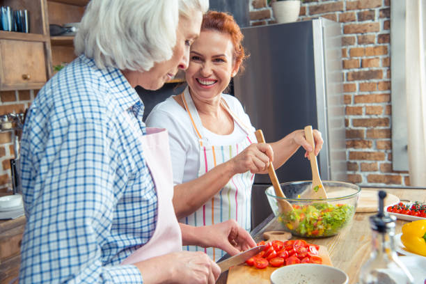 istock Women cooking together 670941768