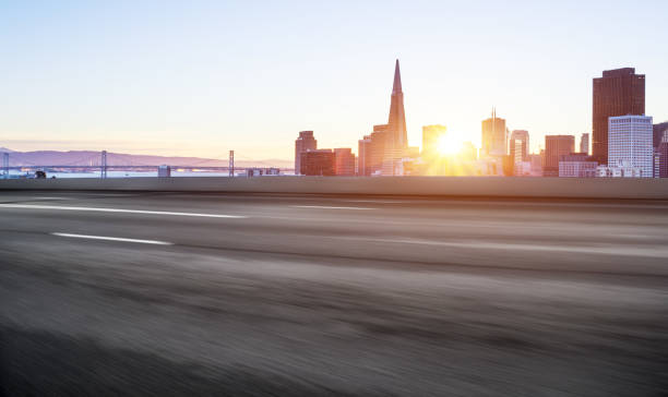 istock empty road with cityscaep of modern city 670947196