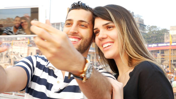 istock Couple taking a selfie in Varanasi, India 670947334