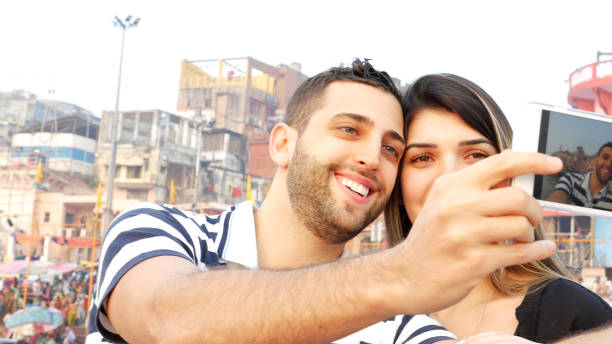 istock Couple taking a selfie in Varanasi, India 670947354