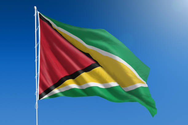 istock National flag of Guyana on clear blue sky 670953720