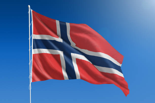 National flag of Norway on clear blue sky stock photo