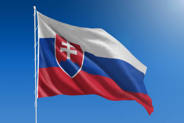 National flag of Slovakia on clear blue sky stock photo
