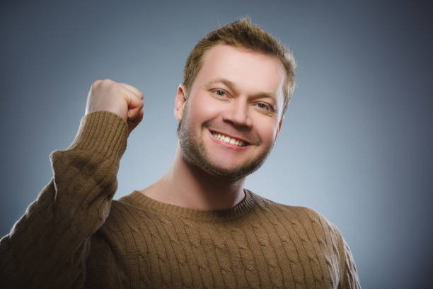 Closeup portrait successful happy man isolated grey background. stock photo