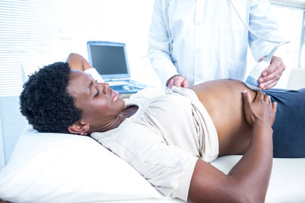 istock Doctor using ultrasound machine on pregnant woman 670961224