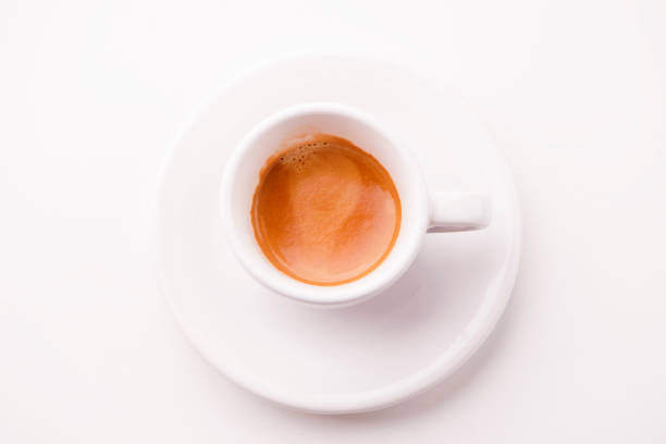 istock cup of espresso coffee isolated on white background 670967500
