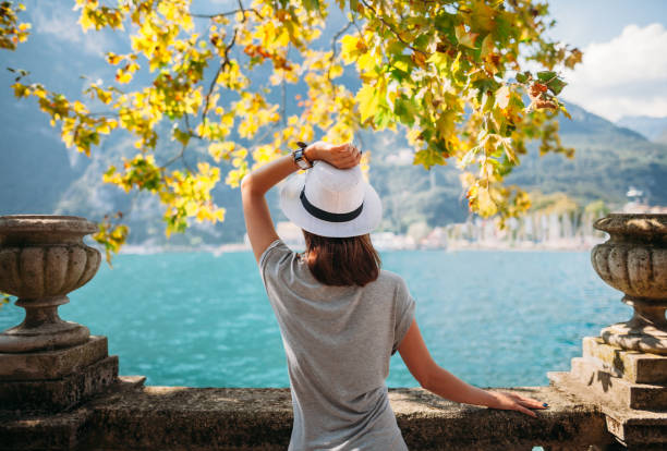 istock Young woman relaxing on beautiful Garda lake 670970608