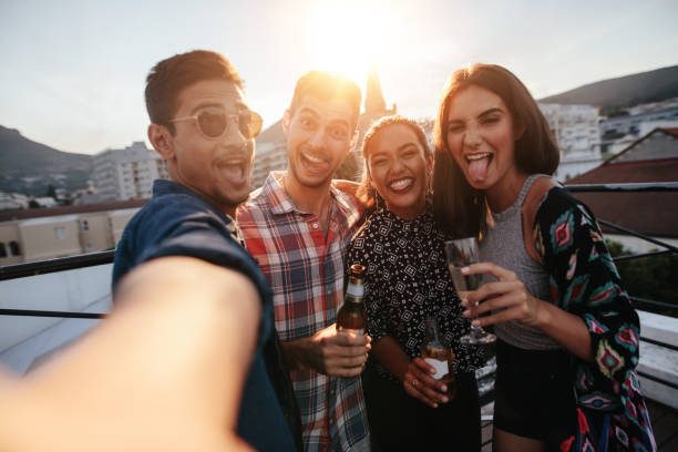 istock Group of people making a selfie at party 670970670