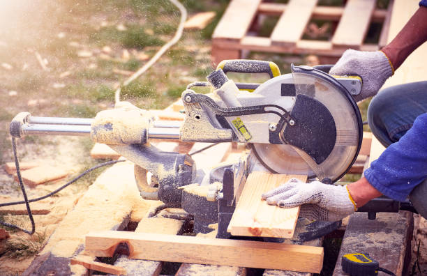 istock Cutting a tree with a circular saw in the workplace. 670971190