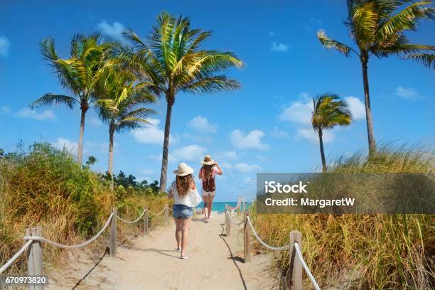 Friends Enjoying Time On The Beach Stock Photo - Download Image Now - Miami, Beach, Vacations