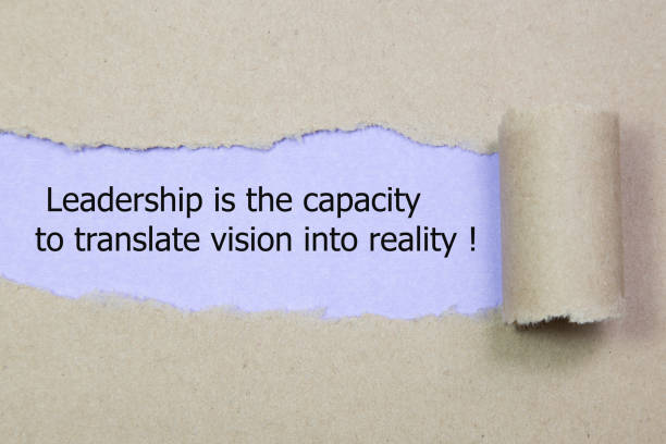 istock Leadership is the capacity to translate vision into reality written under torn paper 670982540