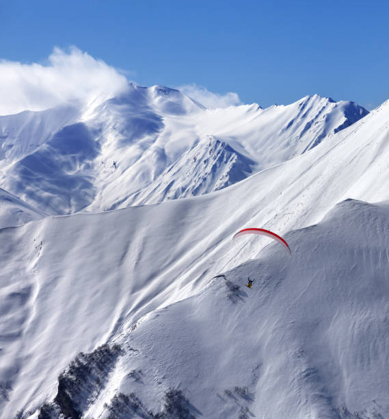 istock Speed flying in snow winter mountains 670987640