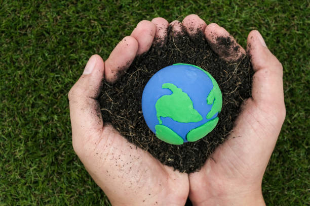 istock Soil and earth made from clay in hand on white background, earth day concept 670991290