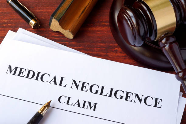 istock Medical Negligence claim  and gavel on a table. 670992470