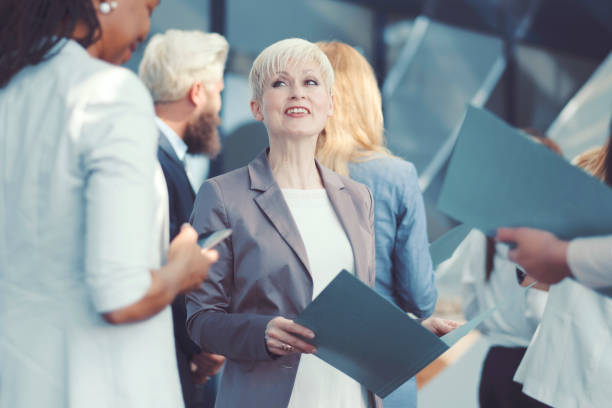istock Group of business people in the office 670995946