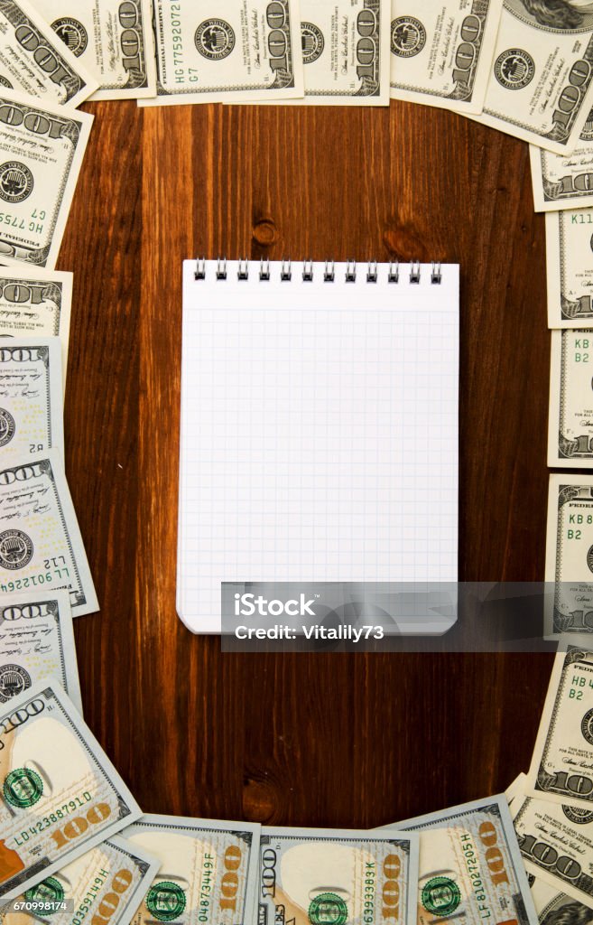 Dollars on a wooden background. dollar top view Dollars on a wooden background. dollar top view . Abundance Stock Photo