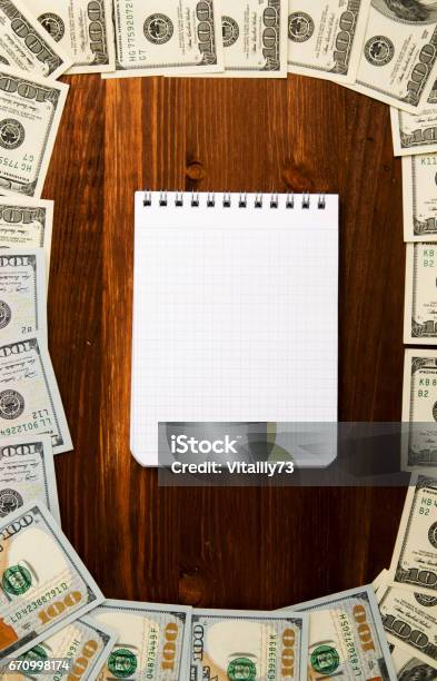 Dollars On A Wooden Background Dollar Top View Stock Photo - Download Image Now - Abundance, American One Hundred Dollar Bill, Backgrounds