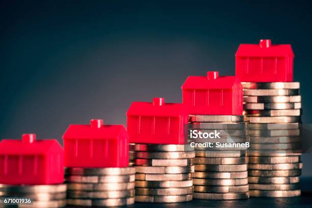 Red Houses And Coins Stock Photo - Download Image Now - Currency, Debt, Financial Loan