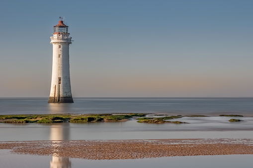New Brighton Lighthouse positioned at the mouth of the River Mersey to secure safe passage for vessals entering the river from the Irsh sea in the UK.