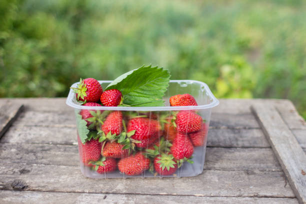 istock Fresh strawberries on wooden table 671008862