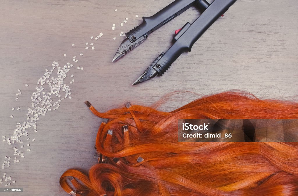 Pre Bonded Keratin Capsules Of Red Hair Extensions Close To Keratin Capsules  And Hair Extension Iron Stock Photo - Download Image Now - iStock