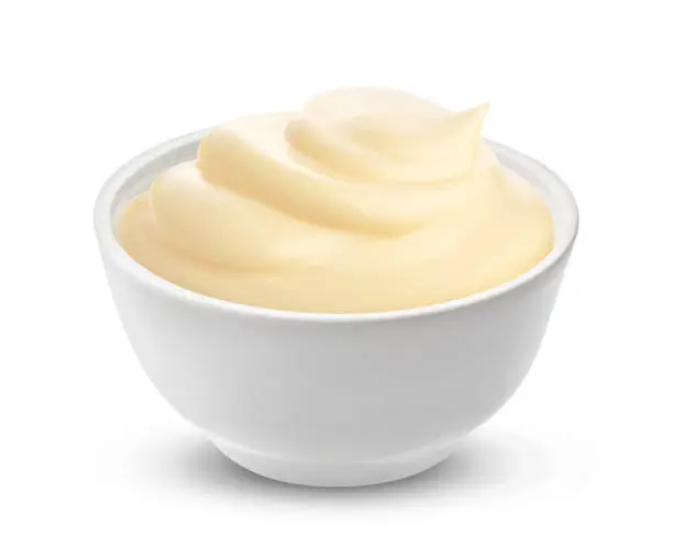 Mayonnaise sauce in bowl isolated on white background with clipping path. One of the collection of various sauces