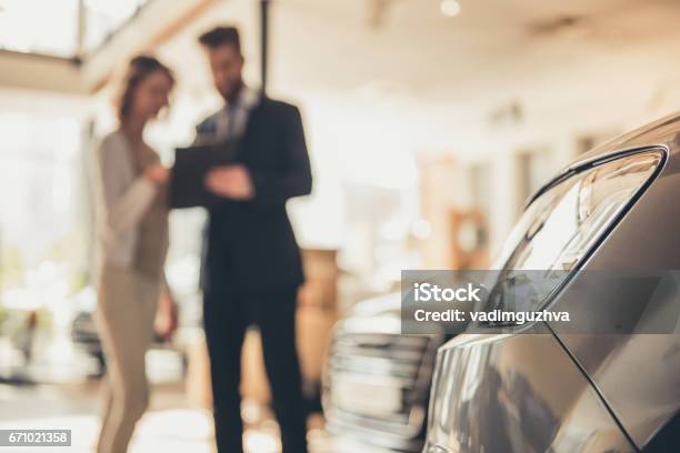 Visiting Car Dealership Stock Photo - Download Image Now - Car, Car Dealership, Car Salesperson