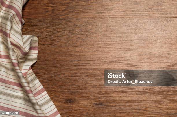 Wood Brown Grain Texture Dark Wood Wall Background Top View Of Wooden Table Green Textile Napkin Stock Photo - Download Image Now