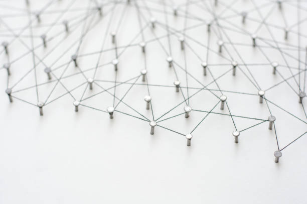 istock Linking entities. Network, networking, social media, internet communication abstract. A small network connected to a larger network. in paper linked together by cotton with a black tint 671032148