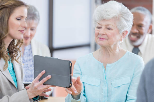 istock Senior woman uses tablet during conference 671032444
