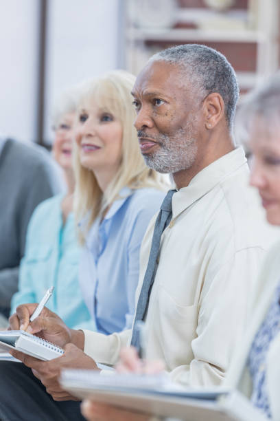 istock African American senior man attends conference 671032456