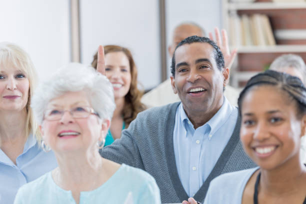 istock Diverse group of people attend business conference 671032474