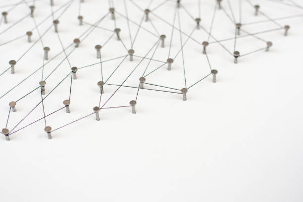 istock Linking entities. Network, networking, social media, internet communication abstract. A small network connected to a larger network. in paper linked together by cotton with a black tint 671034588