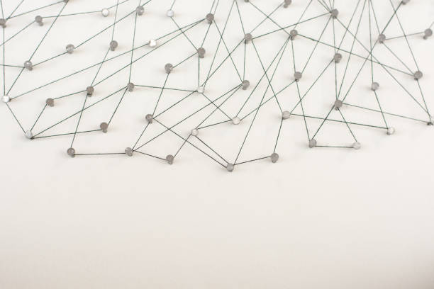 istock Linking entities. Network, networking, social media, internet communication abstract. A small network connected to a larger network. in paper linked together by cotton with a black tint 671038400