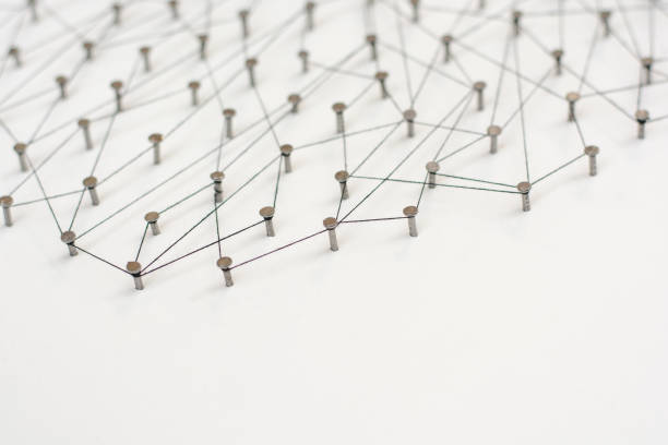istock Linking entities. Network, networking, social media, internet communication abstract. A small network connected to a larger network. in paper linked together by cotton with a black tint 671041630