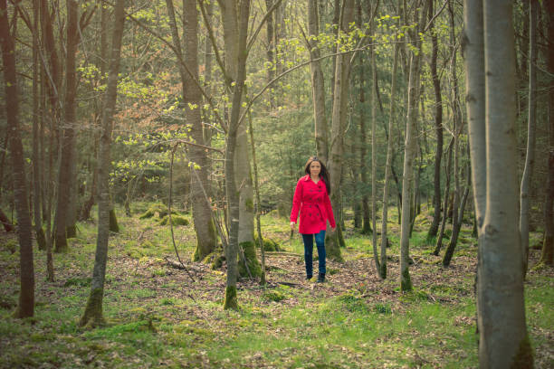 istock Women walking in the forest 671047796