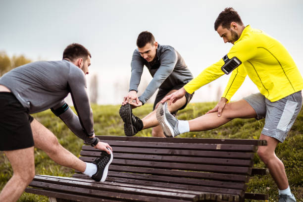 istock group of friends stretching together 671048062