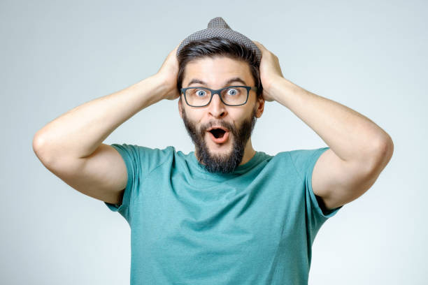 istock Man with shocked, amazed expression isolated on gray background 671050532