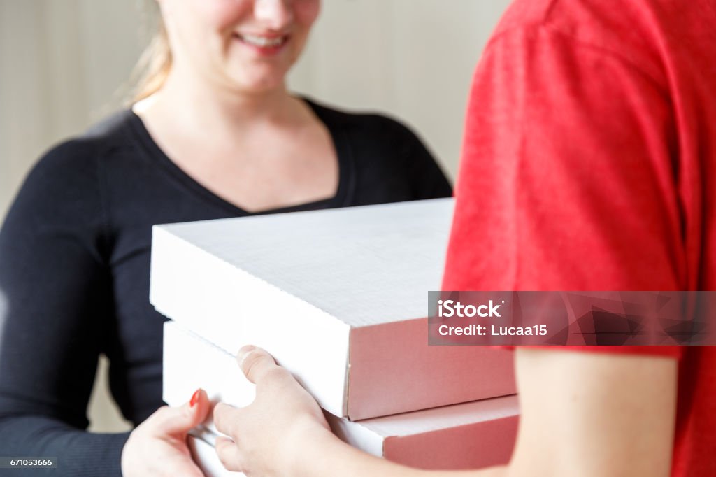 Pizza - Delivery Pizza is handed over - 
 Adult Stock Photo