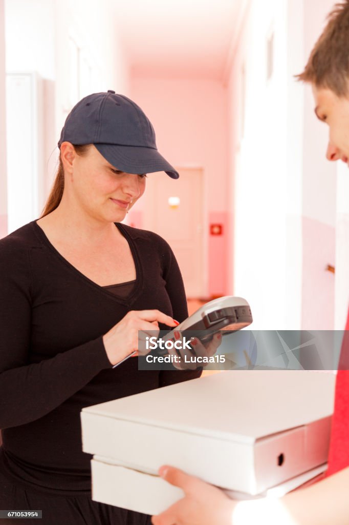 Pizza - Delivery service Payment by ATM - 
 Adult Stock Photo