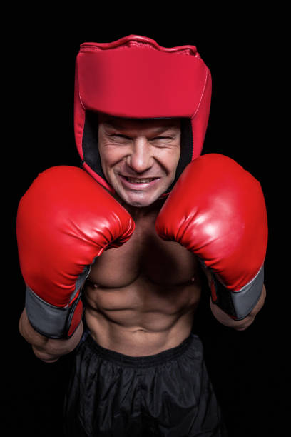 istock Angry boxer with gloves and headgear 671053994