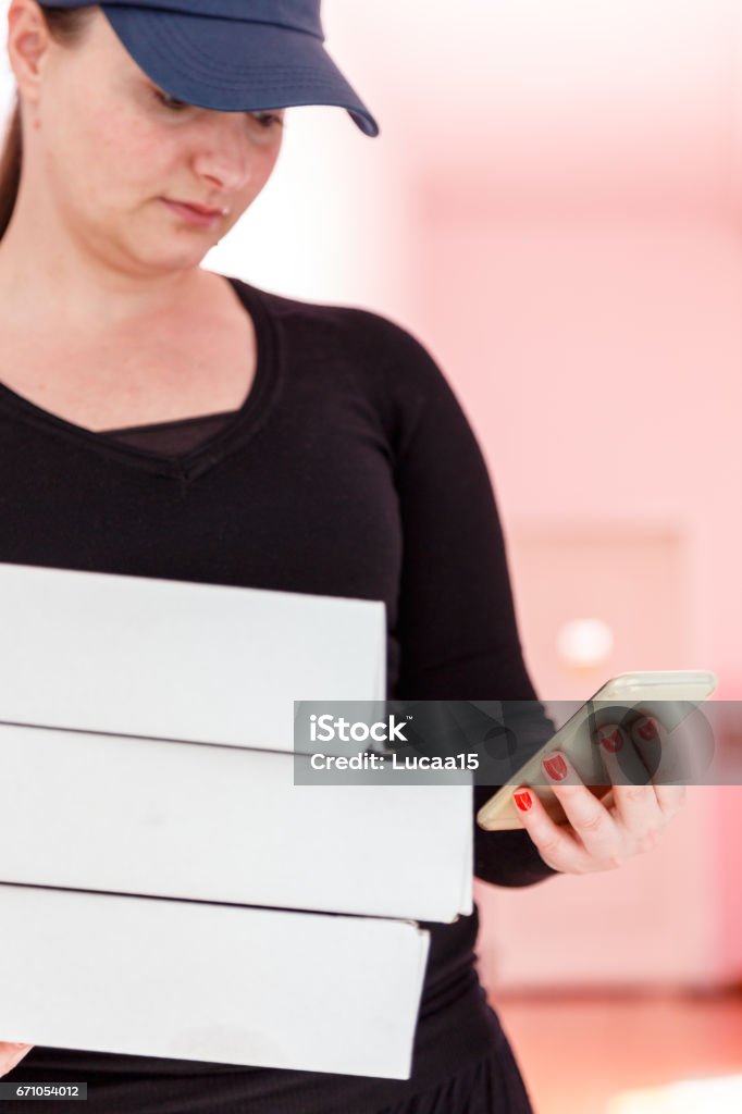 Female person delivers pizza Delivery is just around the corner - 
 Adult Stock Photo