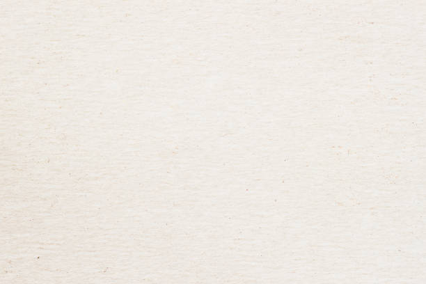 istock Texture of old organic light cream paper, background for design with copy space text or image. Recyclable material, Natural rough, has small inclusions of cellulose 671059288